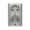 SIMON 54 Gniazdo podwójne z uziemieniem schuko natynkowe z przesłonami torów prądowych wersja skandynawska zaciski śrubowe srebr